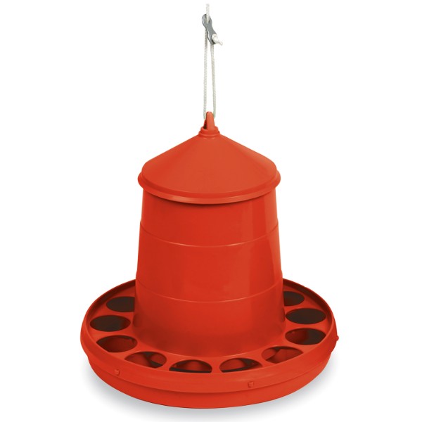 a red plastic chicken feeder